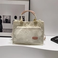 Cream corduroy tote bag with pink leather handles and front pocket for daily commute - No Pendant / Pink
