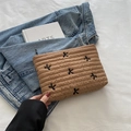 Brown quilted makeup bag with black bow embroidery and secure zipper closure - Khaki