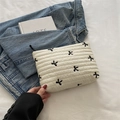 Quilted white fabric cosmetic bag with black embroidered bow and zipper closure - White