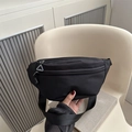 Minimalist black waffle texture waist bag with adjustable strap and grey zip detail - Black