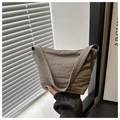 Detail of taupe wrinkled nylon shoulder bag with a wide strap and zip closure - Gray