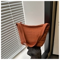 Detail view of brick red nylon hobo bag with zipper and soft wrinkled texture - Orange