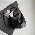 Minimalist black crescent crossbody bag in premium PU leather with adjustable strap - Black