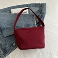 Minimalist burgundy bucket shoulder bag in matte fabric with wide strap for women - Red