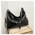 Detail of black large capacity hobo bag featuring adjustable straps and gold hardware - Black