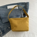 Minimalist ginger yellow bucket bag with wide handle made of pleated nylon fabric - Yellow