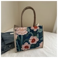 Close-up of ethnic floral print on large capacity linen tote bag with sturdy khaki straps - Blue