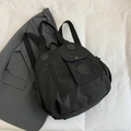 Versatile black nylon travel backpack with front flap pocket and sturdy shoulder straps - Black