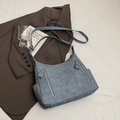 Large capacity crossbody bag in grey-blue denim texture with functional front zipper pockets - Blue