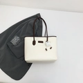 Cream tote bag with brown handles, brand tag and a cute plush ball charm - With Pendant / Brown
