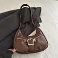 Retro dark brown leather hobo bag with silver buckle and decorative zippers on top of a suit - Brown
