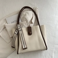 Cream trapezoid tote bag with brown straps and LOVE woven ribbon detail - Off White