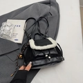 Detail of mini black faux suede backpack with white fuzzy trim and drawstring closure - With Pendant / Black