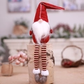Christmas gnome doll with long striped legs and red felt hat for holiday decoration - Red