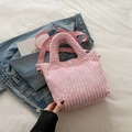 Pink corduroy bucket bag with plush texture, round top handles and adjustable strap - Light Pink