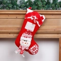 Red knitted Christmas stocking with a 3D snowman figure and name tag on a wooden mantel - Snowman