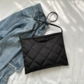 Quilted black nylon crossbody bag with diamond stitch pattern and slim shoulder strap - Black