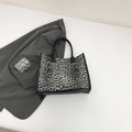 Vintage-Tragetasche mit Leopardenmuster, schwarzen Griffen und grauem Muster - Schwarz