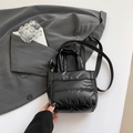 Black quilted puffer bucket bag with glossy finish and adjustable crossbody strap - Black