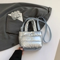 Metallic silver quilted down bucket bag with shoulder strap and stylish top handle - Silver