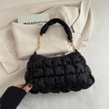 Chic black cloud puffer shoulder bag with quilted texture and gold chain link handle - Black