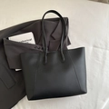 Minimalist black tote bag in matte synthetic leather with decorative stitching detail - Black without Pendant