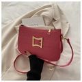 Detailed view of rose pink quilted shoulder bag with gold hardware and square buckle - Pink