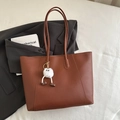 Minimalist brown leather tote bag with long shoulder straps and white plush pendant - Reddish Brown With Pendant