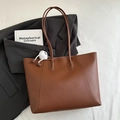 Brown leather tote bag with stylish stitching and white plush monster charm accessory - Yellowish Brown With Pendant