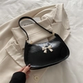 Retro black leather underarm bag with silver bow accent and distressed oil-wax texture - Black