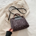 Retro leopard print bucket bag with wood handle and adjustable black leather strap - Black