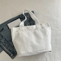 Sac fourre-tout en toile blanche avec trois poches avant pour un style minimaliste pur - Blanc