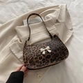 Chic leopard print baguette bag with a silver bow ornament and shoulder strap - Leopard Brown