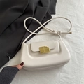 Creamy white crossbody bag featuring a unique gold chocolate-style buckle and knotted strap - White
