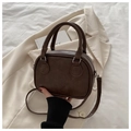 Detail of vintage brown PU leather bag showing Lucky Ohio Bmu embossed text and silver hardware - Dark Brown