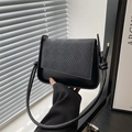 Minimalist black flap shoulder bag with woven texture patchwork and knotted strap design - Black