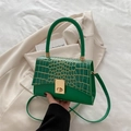 Green crossbody bag with gold crocodile pattern flap and metallic twist lock for women - Green