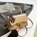 Beige faux leather crossbody bag with vintage gold clasp and pretzel charm detail - Khaki With Pendant