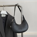 Minimalist black crescent moon underarm bag with woven texture and sleek silver hardware - Black
