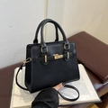 Elegante schwarze Handtasche mit goldenem Verschluss und Griff für Damen - Schwarz