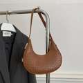 Chic caramel crescent bag with woven texture on a metal hanger for minimalist style - Brown