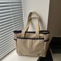 Khaki corduroy tote bag with blue trim and external pockets for casual commuting - Khaki