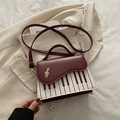 Burgundy and cream piano keyboard satchel with gold musical note and adjustable strap - Red