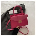 Detail of hot pink crossbody bag with gold floral buckle and adjustable strap - Rose Pink