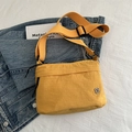 Chic yellow nylon crossbody bag with wide shoulder strap and silver floral logo detail - Yellow