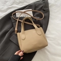 Minimalist apricot pebbled leather bucket bag with top handles and adjustable shoulder strap - Khaki (No Pendant)