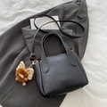 Black lychee leather bucket bag with fashion lettering and cute plush monster charm - Black With Pendant
