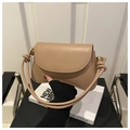 Detail of nude khaki faux leather bag with gold logo and knotted shoulder strap - Khaki