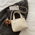 Chic beige lychee leather bucket bag with fashion lettering and cute plush charm - White With Pendant