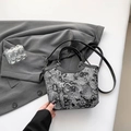 Elegant black silk bucket bag with white embroidery and adjustable shoulder strap - Black